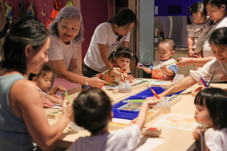 kids doing art in the art studio at the state library qld