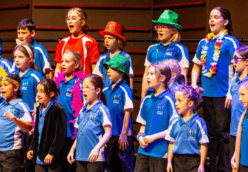 Voices of Birralee choir on stage.