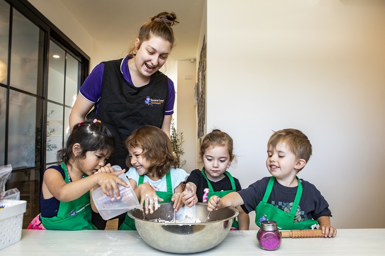 Sesame Lane childcare children cooking with carer.