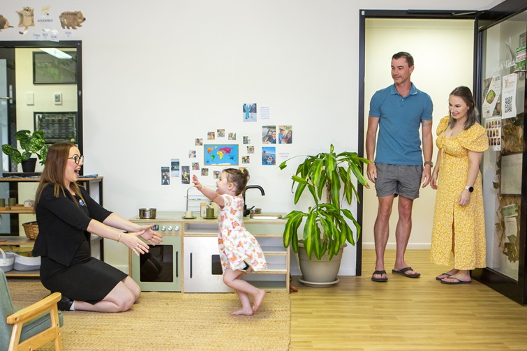 child being greeted by carer at sesame lane childcare.