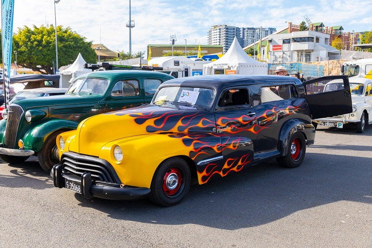 RACQ MotorFest image of classic car with yellow and red flames painted down the car.