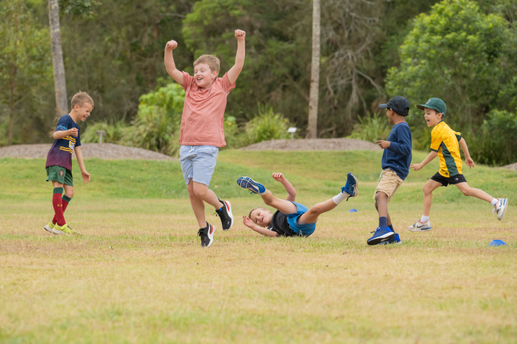 Q Kids Sport happy kids playing sport.