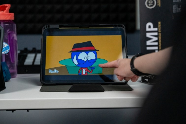 The Lab student pointing at screen.