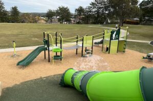View of the playground from the top of the tunnel slide at Grandview Place Park.