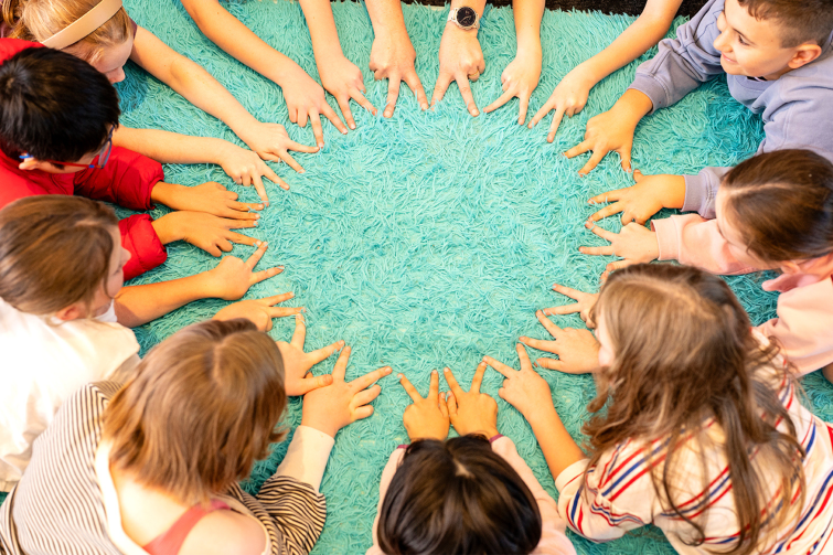 Teacup Coach hands in circle.