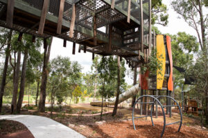 Billubera park Yarrabilba main play structure with towers and bridge with several slides