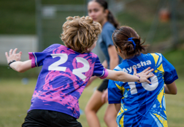 Kick It 4 Kids kids playing touch football.