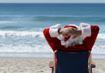 santa sitting on the beach in australia