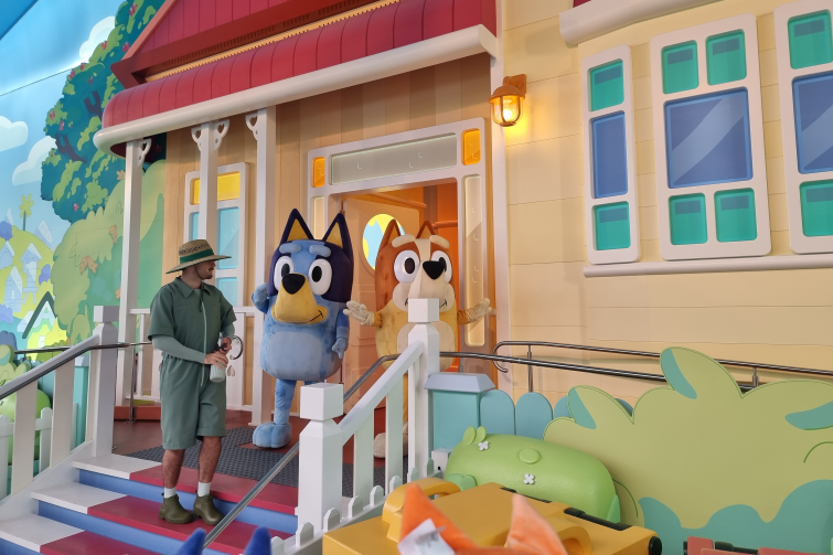 Bluey's World review August 2025 Bluey's house verandah with Bluey and Bingo.