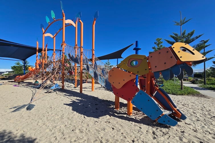 Dinosaur climbing structure at the Dino Park in Aura.