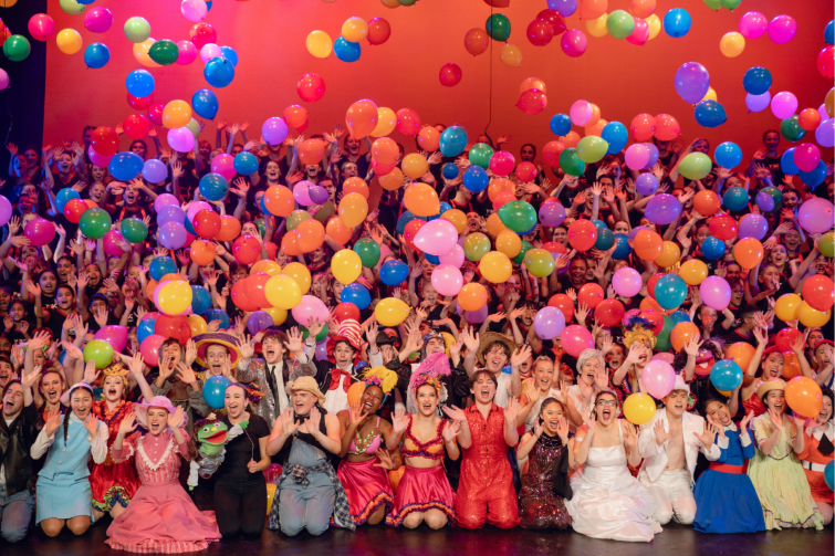 Stage School Australia whole cast on stage with balloons.