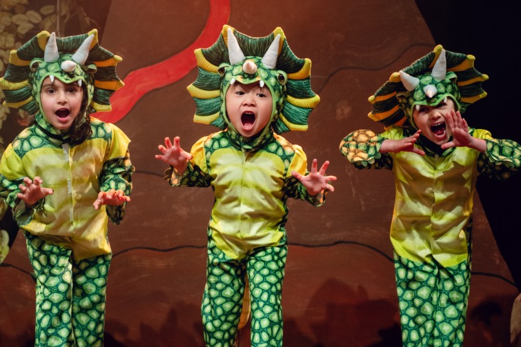Stage School Australia young performers in dragon costumes.