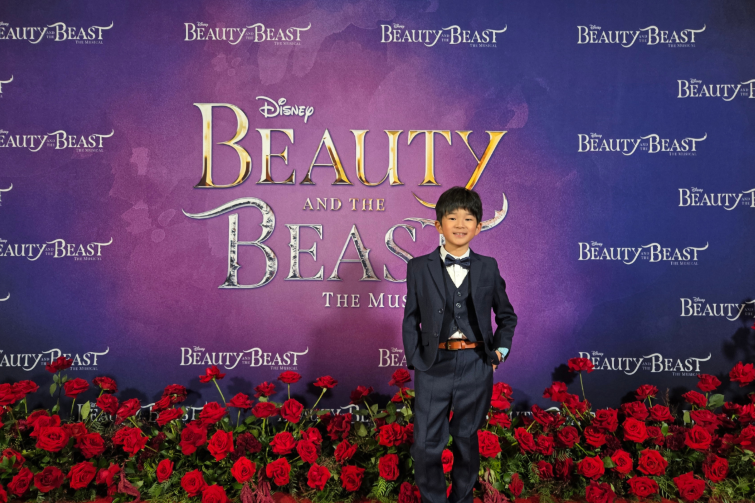 Talent Company of Australia young actor in front of Beauty and the Beast theming.