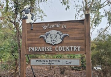 Sign for Paradise Country and Farmstay.