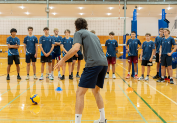 Sharks Volleyball Coaching coach giving instruction.