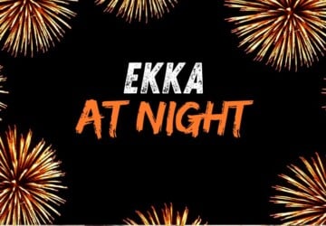 Ekka at night words with fireworks around edges.