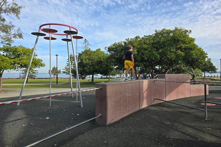Boy walking on wall at Redcliffe Parkour Park.