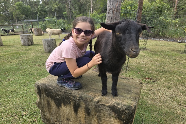 Girl and goat at Paradise Country.