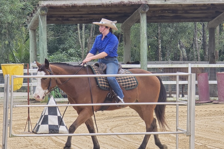 Lady riding a horse at Paradise Country.