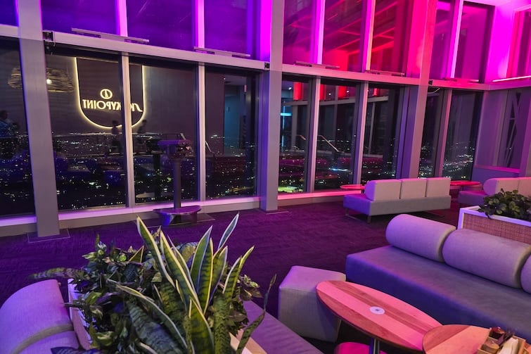 Couches at SkyPoint Observation Deck at night.