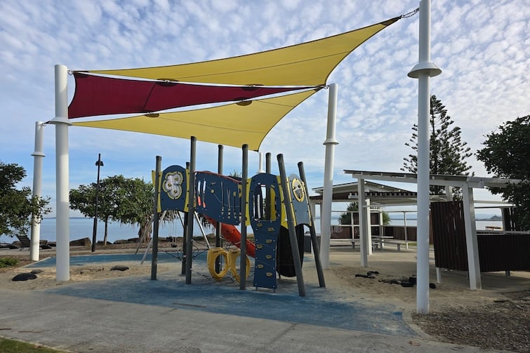 Shade sails and playground beside Redcliffe Parkour Park.