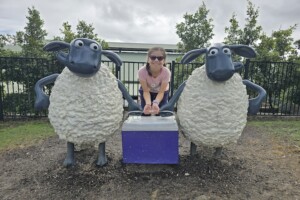 Girl posing with Shaun the sheep characters and esky at Paradise Country.