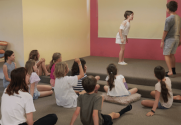 Play on Stage class watching performers.