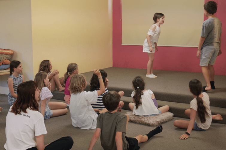Play on Stage class watching performers.