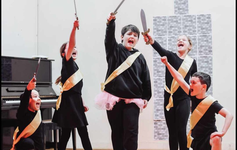 Play on Stage group in costume rehearsing.