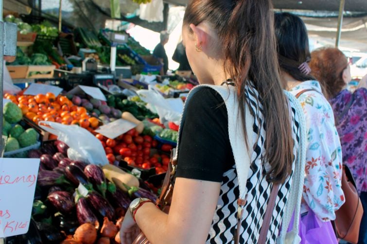 Person browsing markets.