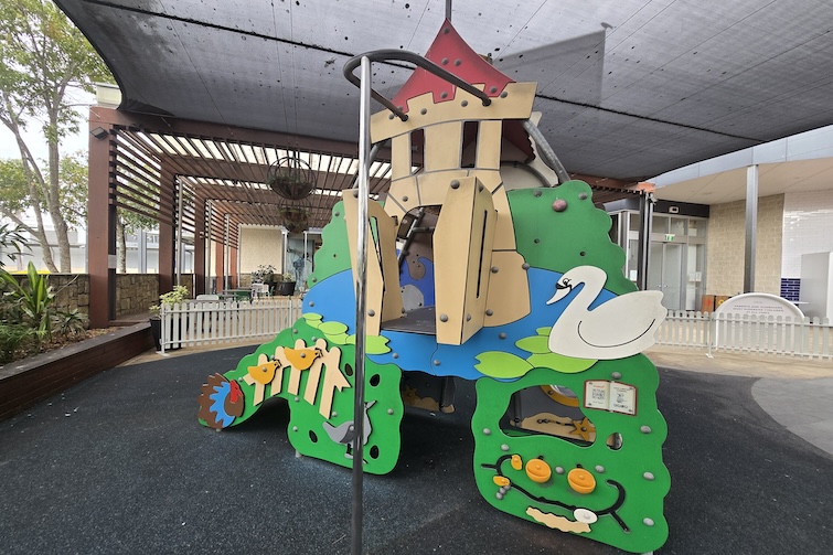 Sliding pole and toddler play fort at Westfield North Lakes play area.