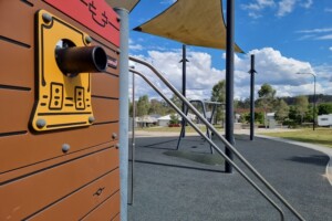 Sliding poles and telescope at Flagstone Pirate Park.