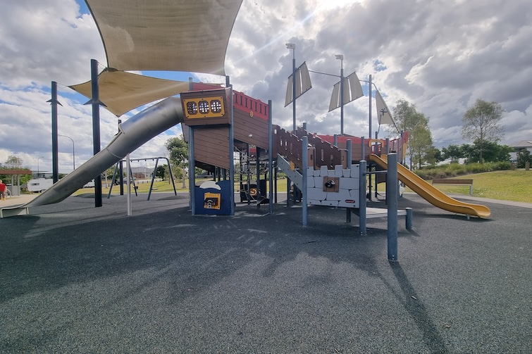 Tunnel slide and pirate ship fort at Flagstone Pirate Park.