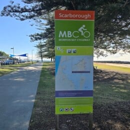 Moreton Bay Cycleway sign and path near Scarborough Beach Park.