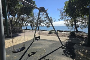 Swings at the playground at Settlement Cove Lagoon in Redcliffe.