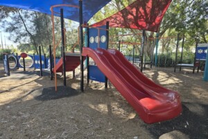 Dual, red slide at Decker Park.