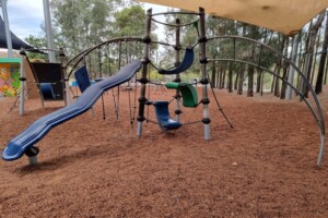Slide and climbing opportunities in the playground at Upper Kedron Recreation Reserve.