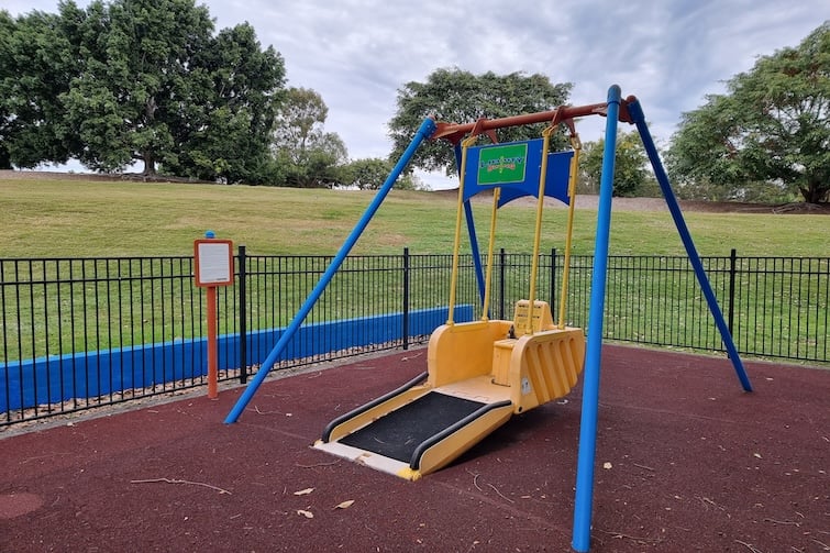 Fenced liberty swing at Upper Kedron Recreation Reserve.