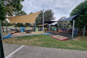Playground with shade sails at Upper Kedron Recreation Reserve.