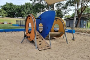 Sand play in the playground at Upper Kedron Recreation Reserve.
