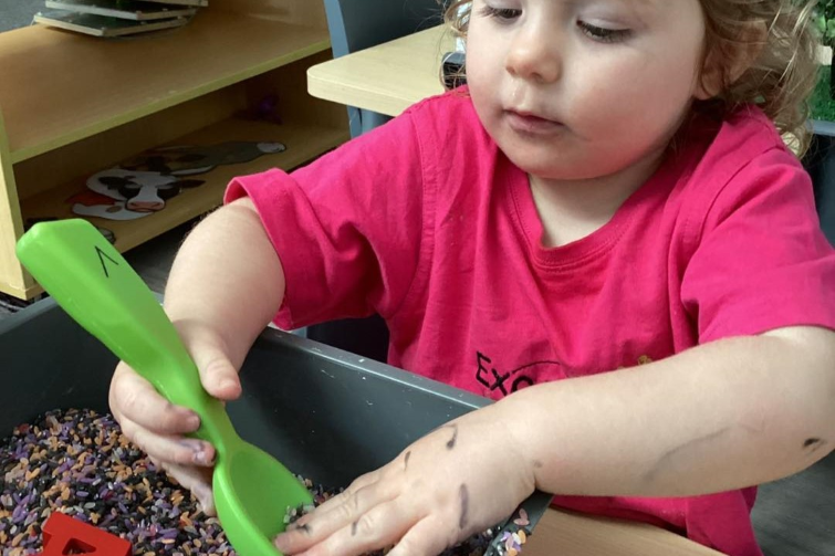 Expeditions Early Learning Journey Raceview digging in rice.