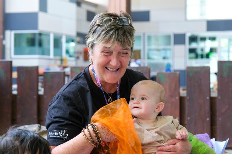 Expeditions Early Learning Journey Underwood staff with young child.