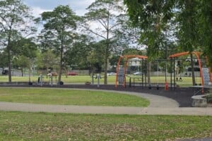 Pathway next to outdoor exercise equipment.