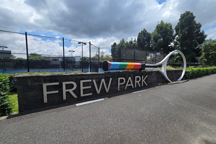 Frew Park sign and big tennis racquet.