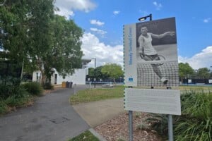 An informative tennis sign at Frew Park.
