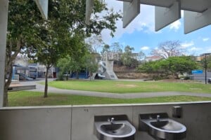 Two sinks and a view of the playground at Frew Park.