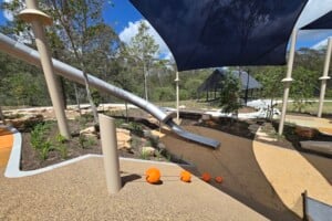 Embankment and large tunnel slide at Glider Park in Morayfield.