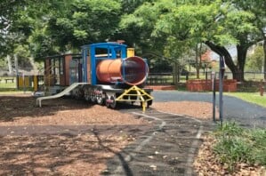 Painted tracks and stationary train at Milton Park.