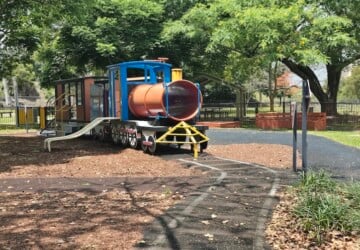 Painted tracks and stationary train at Milton Park.