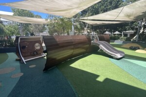 Play panels and small slide at The Backyard at Westfield Coomera.